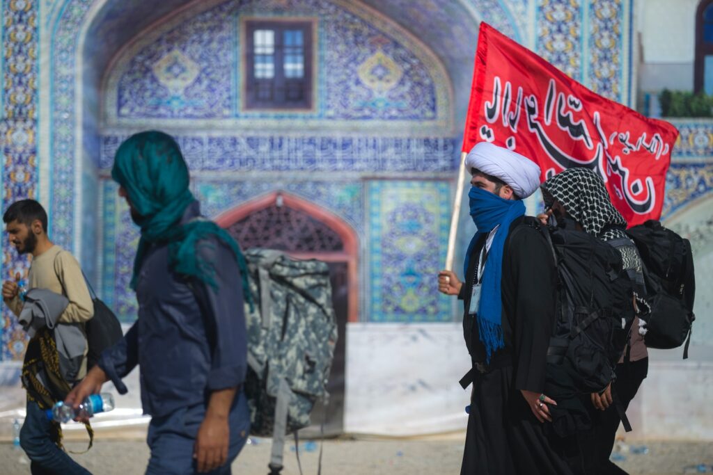 person carrying red flag